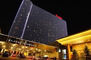 ATLANTIC CITY, NJ - MAY 8: Visitors enter the Borgata Hotel and Casino May 8, 2004 in Atlantic City, New Jersey. Trump Hotels & Casino Resorts, Inc., which is $1.8 billion in debt, posted a first quarter loss on April 30, 2004 of $48 million, double its losses for the same quarter a year ago. Trump's hotels and casinos face increasing competition in Atlantic City, especially from relatively new Borgata. (Photo by Craig Allen/Getty Images)